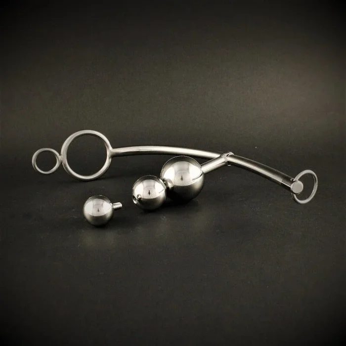 Bondage string with ring and ball
